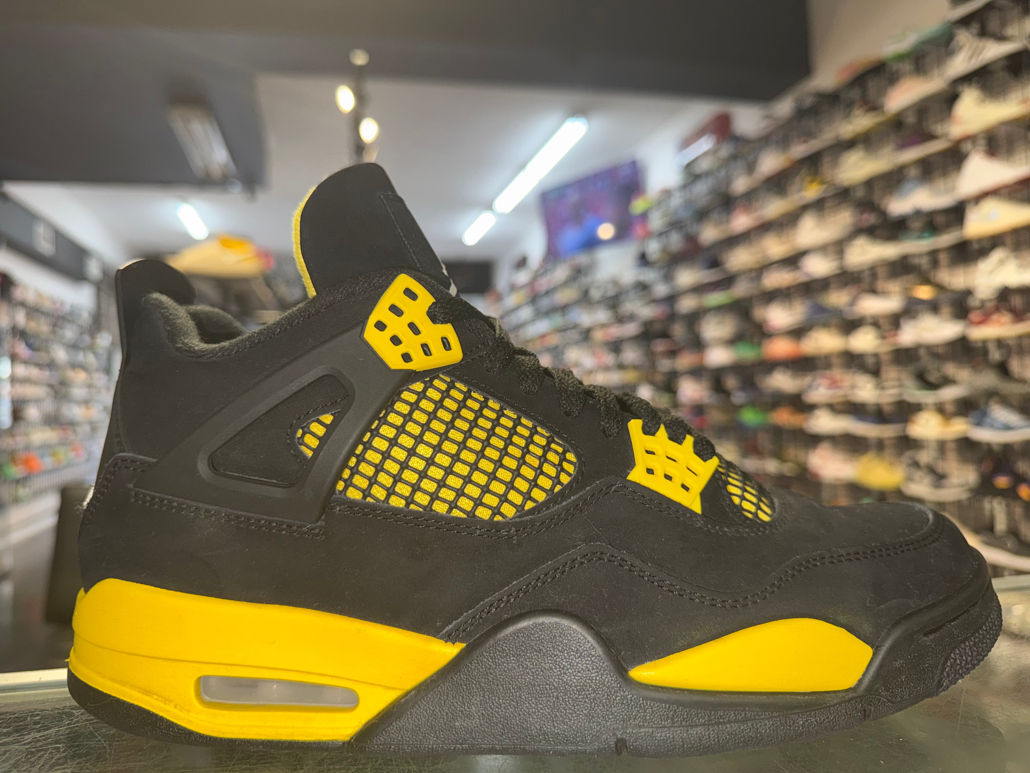 Size 9.5 Air Jordan 4 "Thunder"