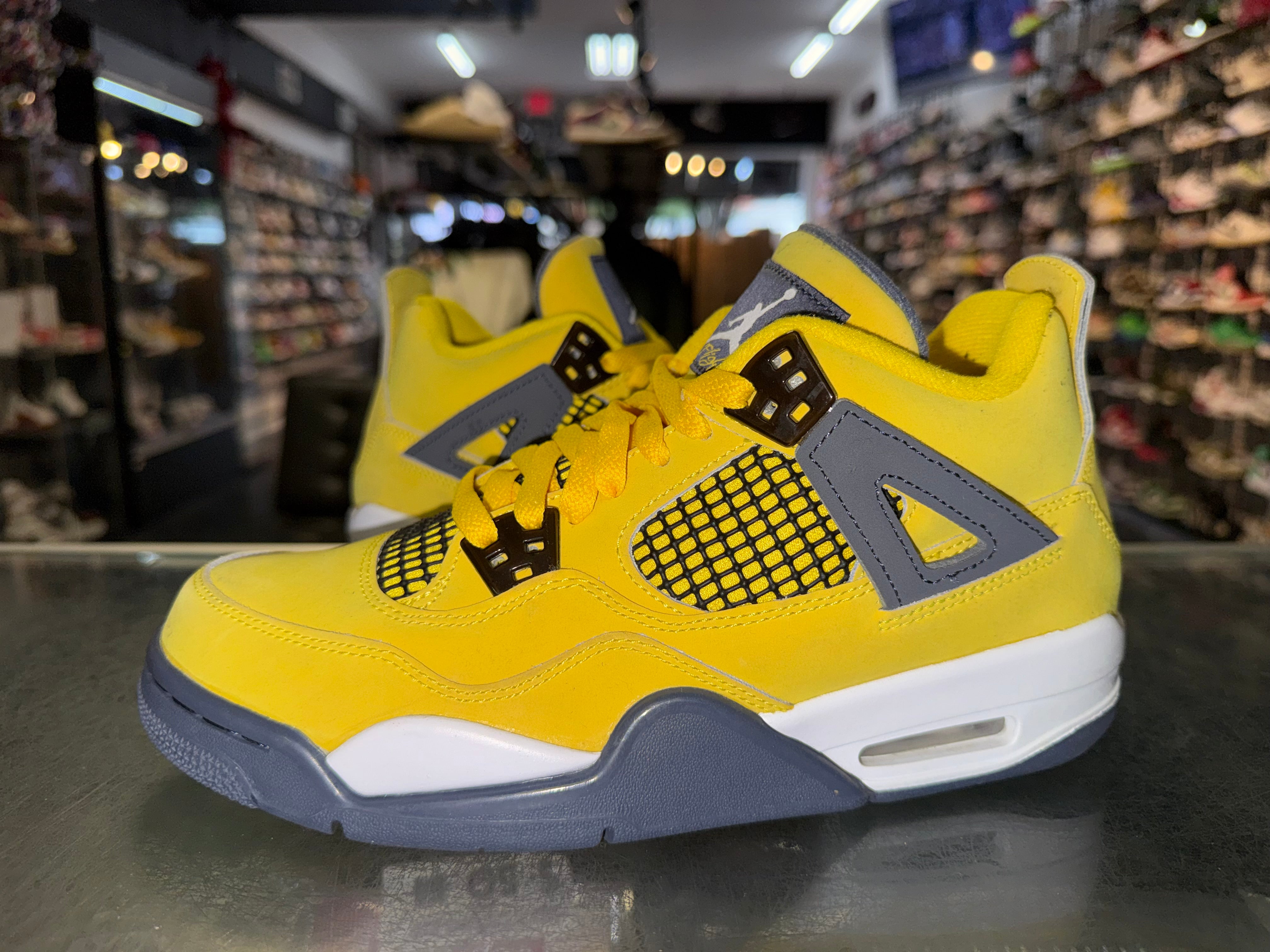Size 7y Air Jordan 4 "Lightning"