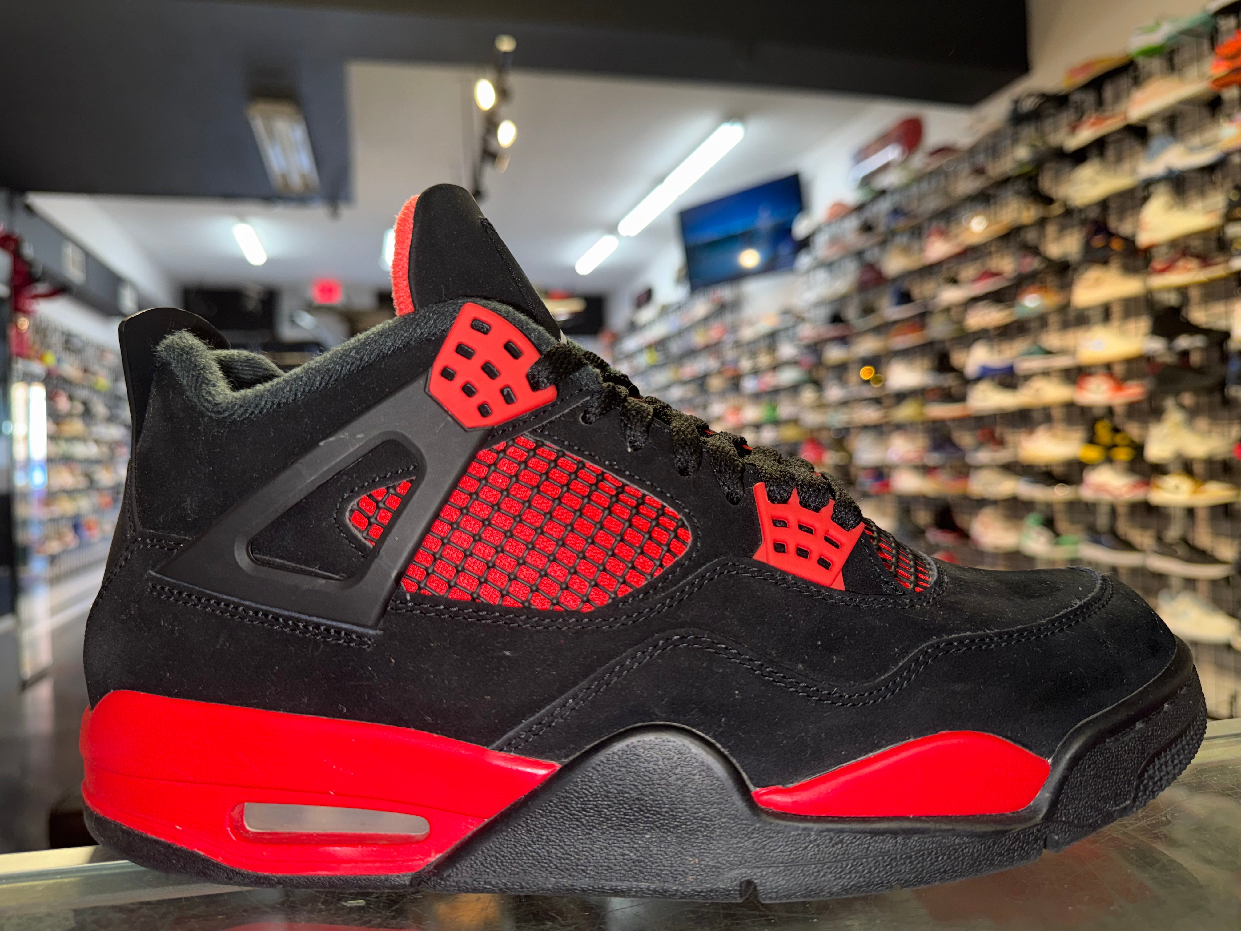 Size 9.5 Air Jordan 4 "Red Thunder"