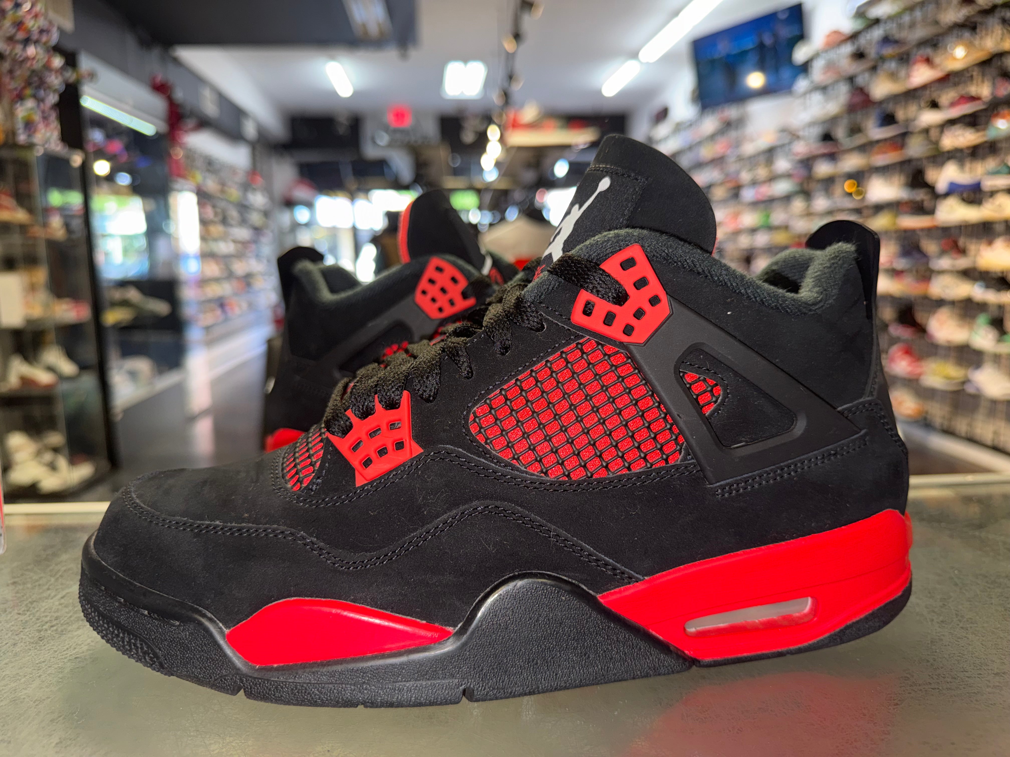 Size 9.5 Air Jordan 4 "Red Thunder"