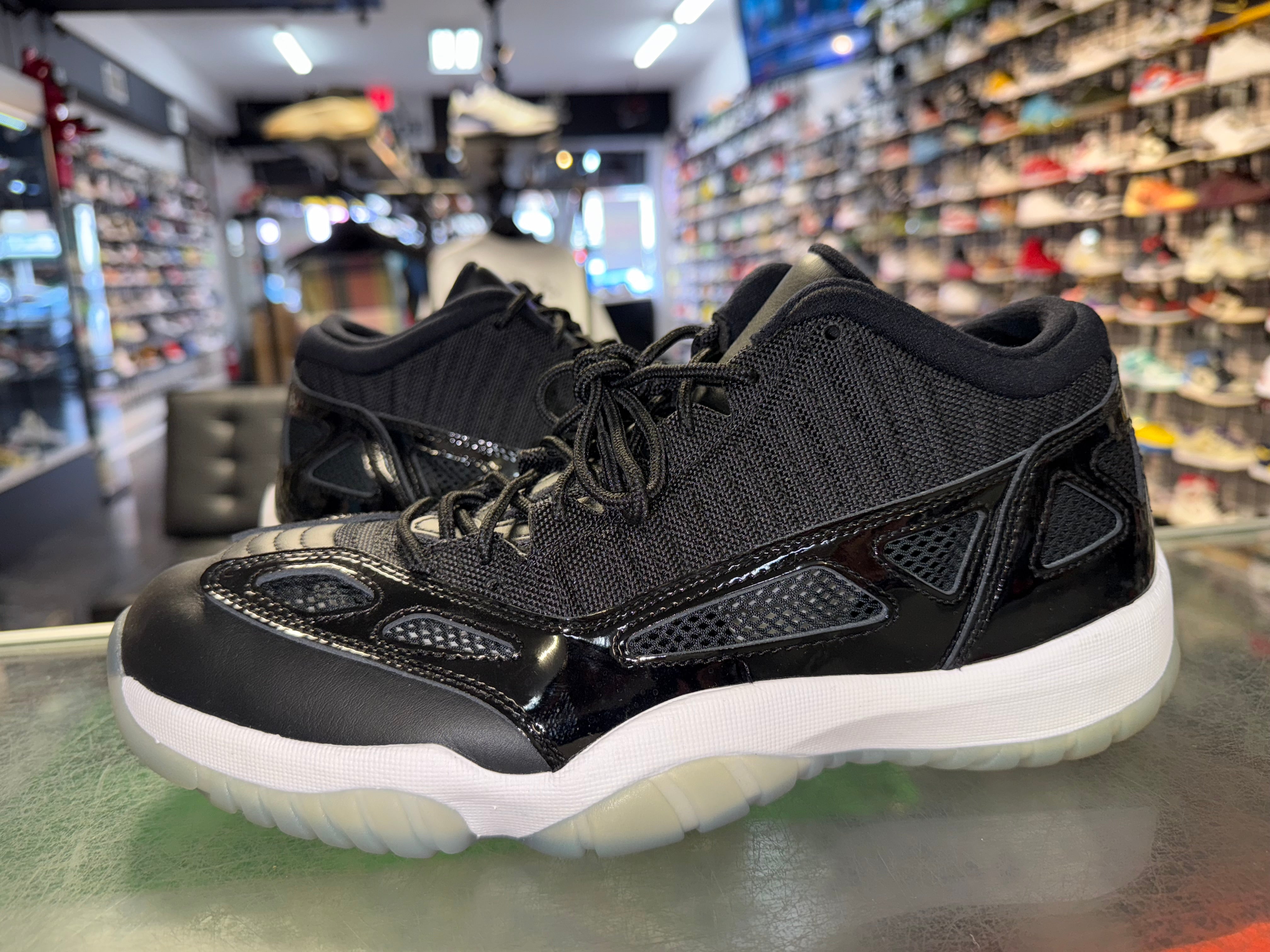 Size 11.5 Air Jordan 11 Low IE "Space Jam"