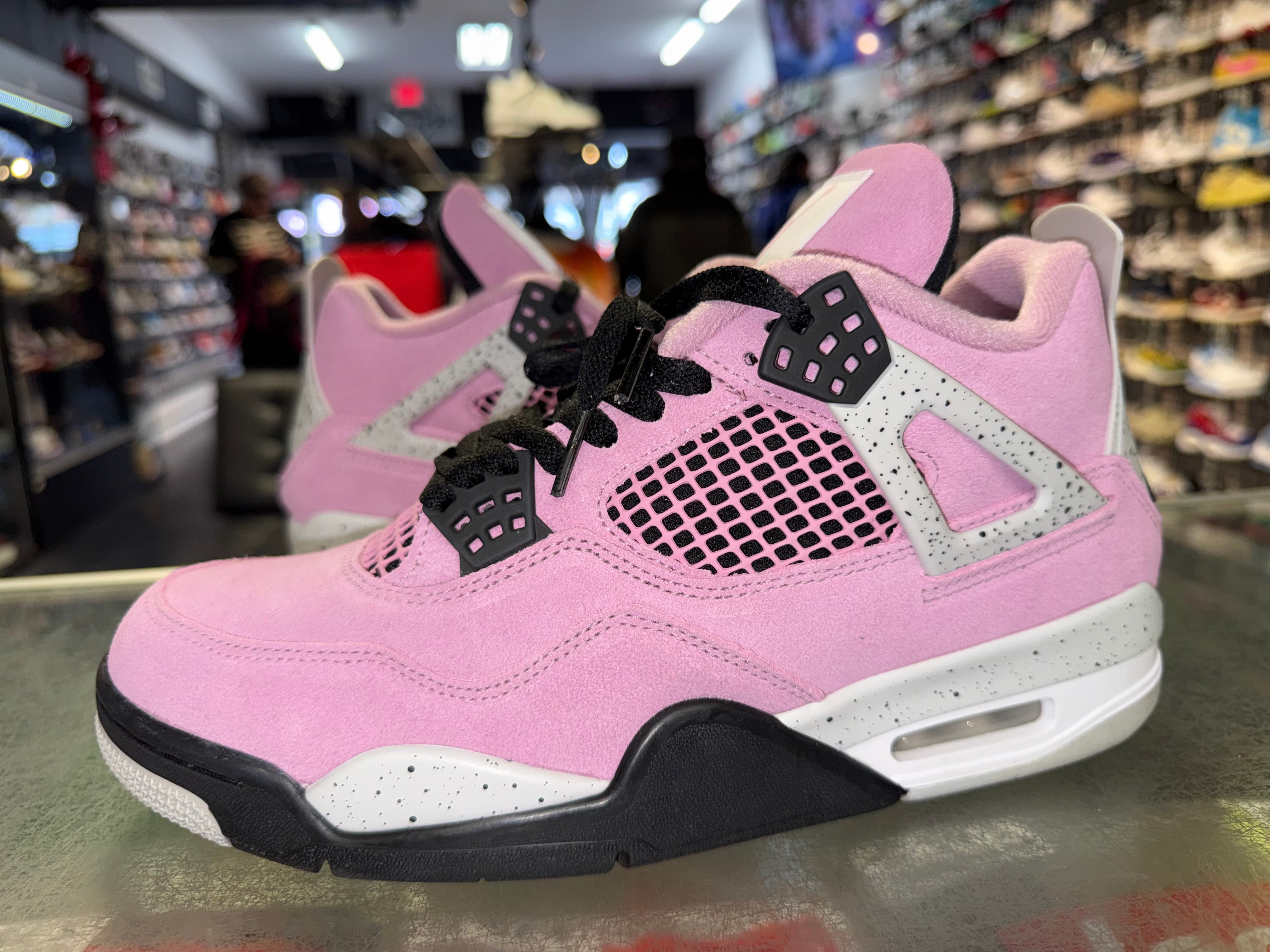 Size 9.5 (11W) Air Jordan 4 “Orchid”