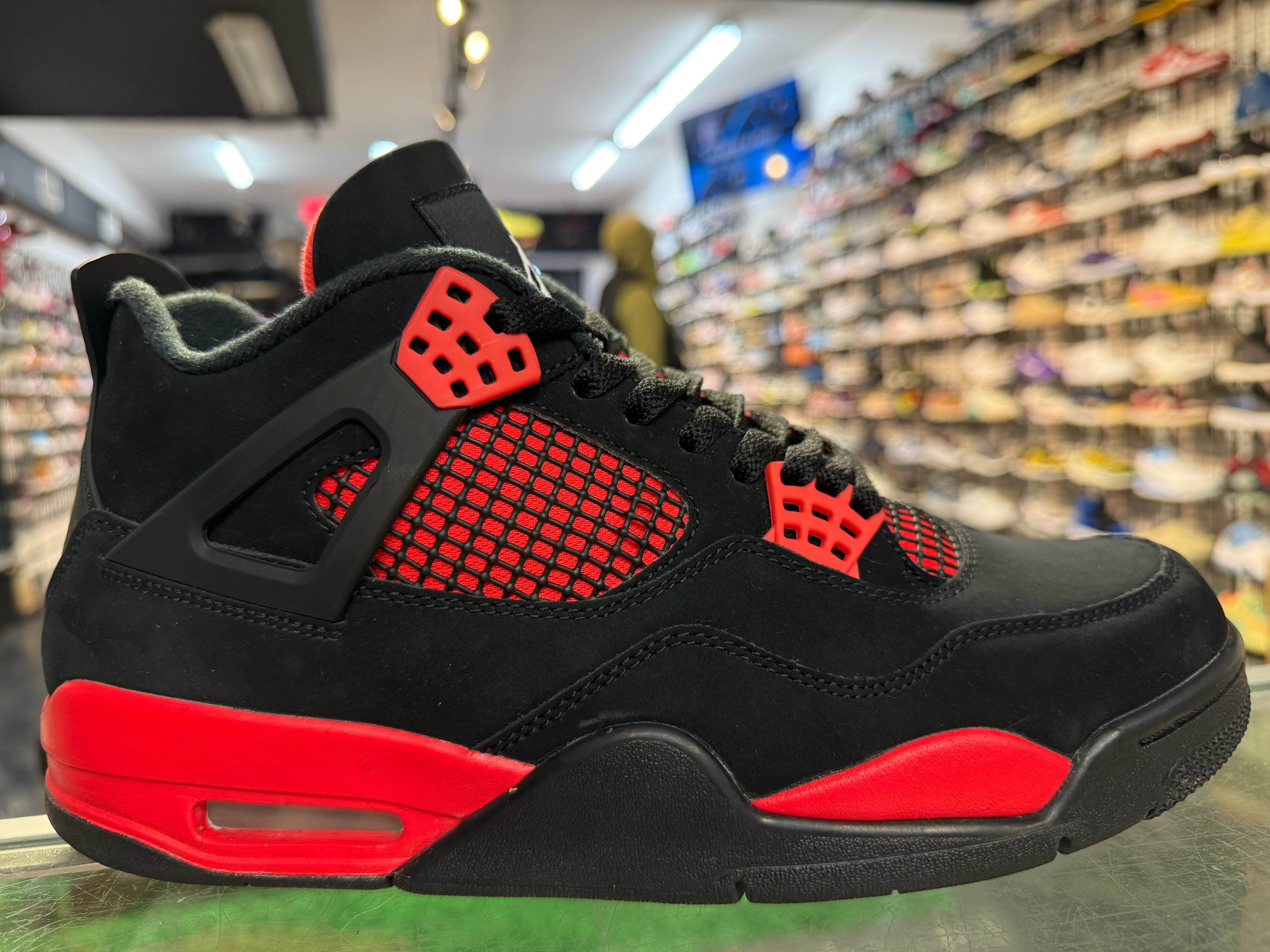 Size 9.5 Air Jordan 4 "Red Thunder"