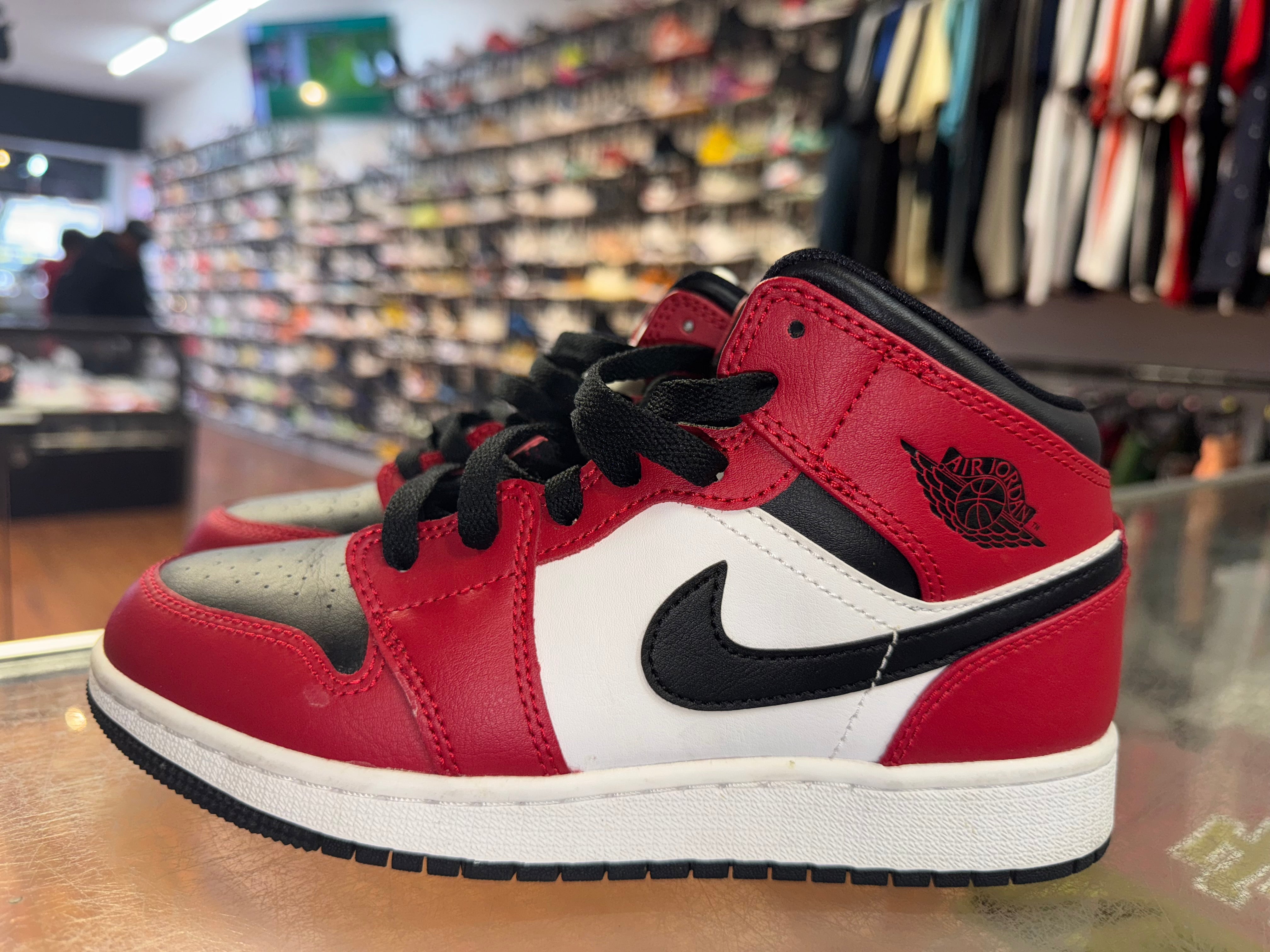 Size 4y Air Jordan 1 Mid "Chicago Black Toe"