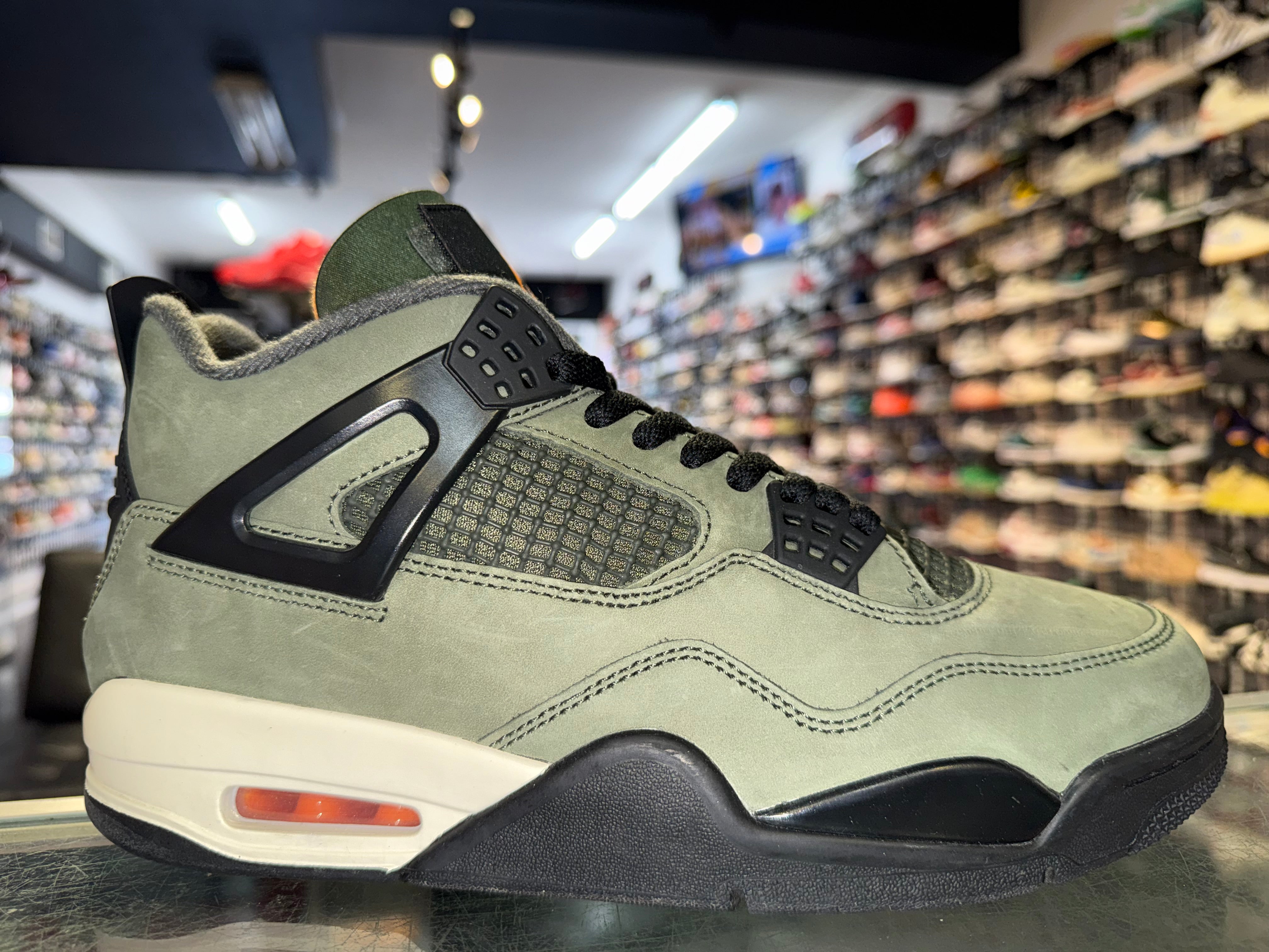 Size 8.5 Air Jordan 4 “Undefeated”