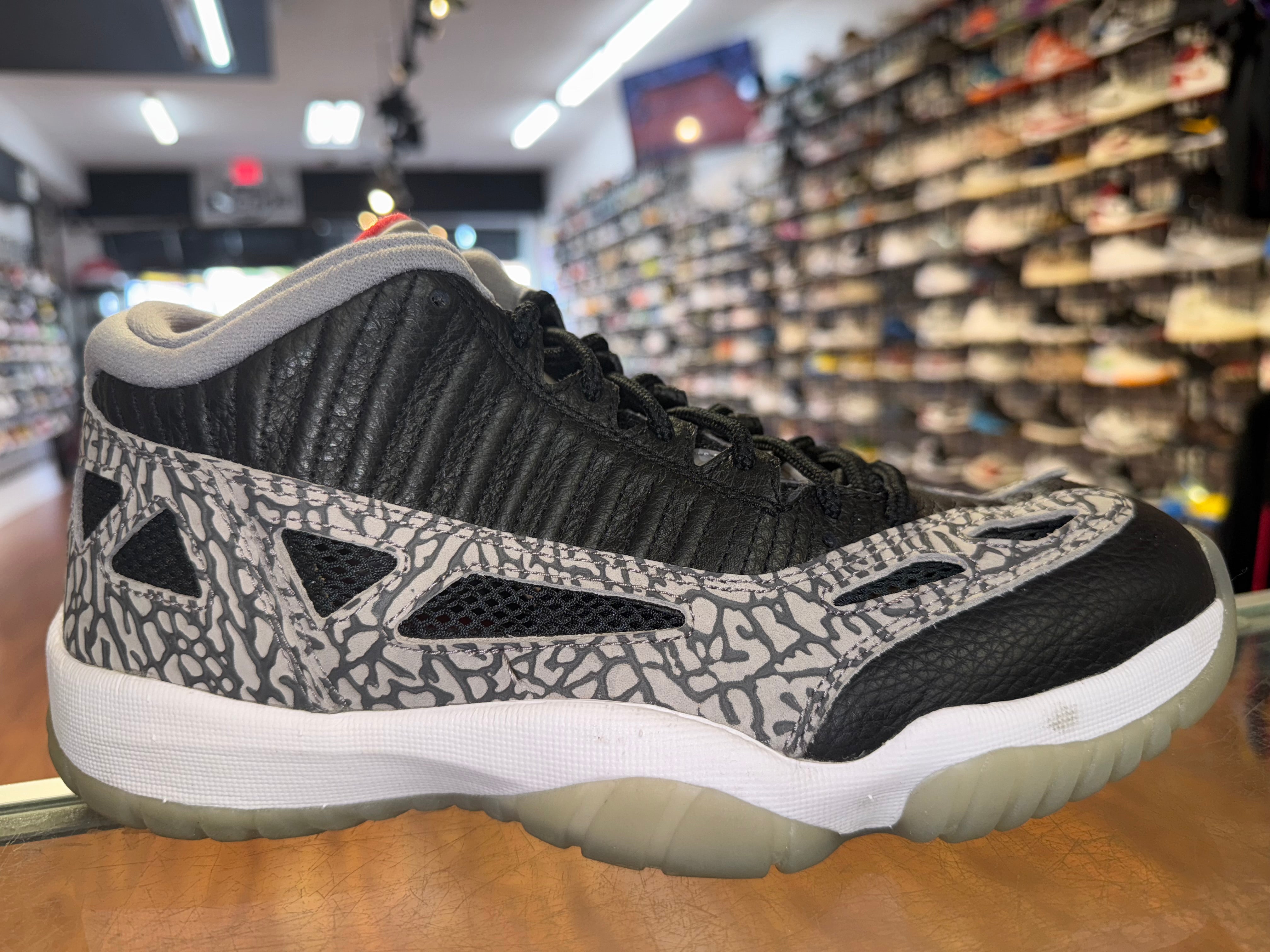 Size 8.5 Air Jordan 11 Low IE “Black Cement”