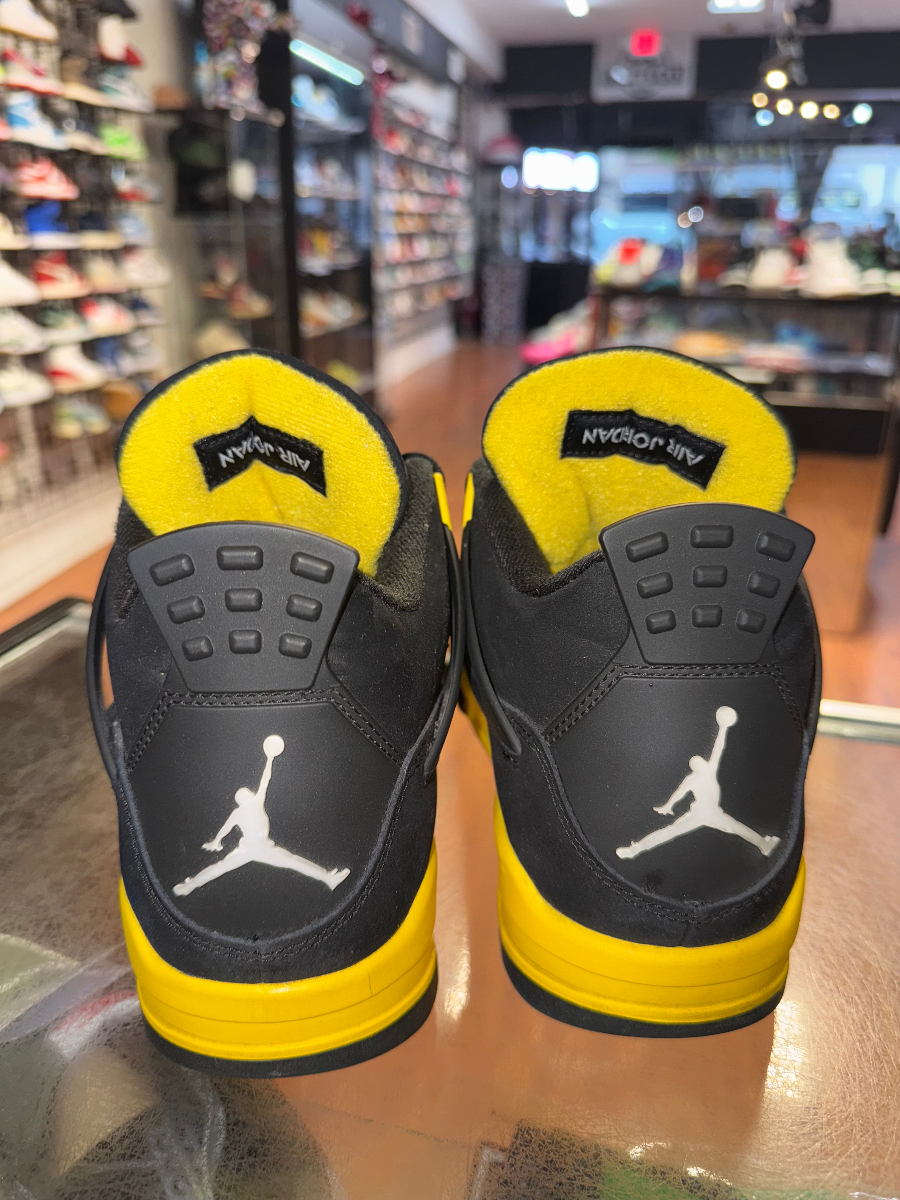 Size 9.5 Air Jordan 4 "Thunder"
