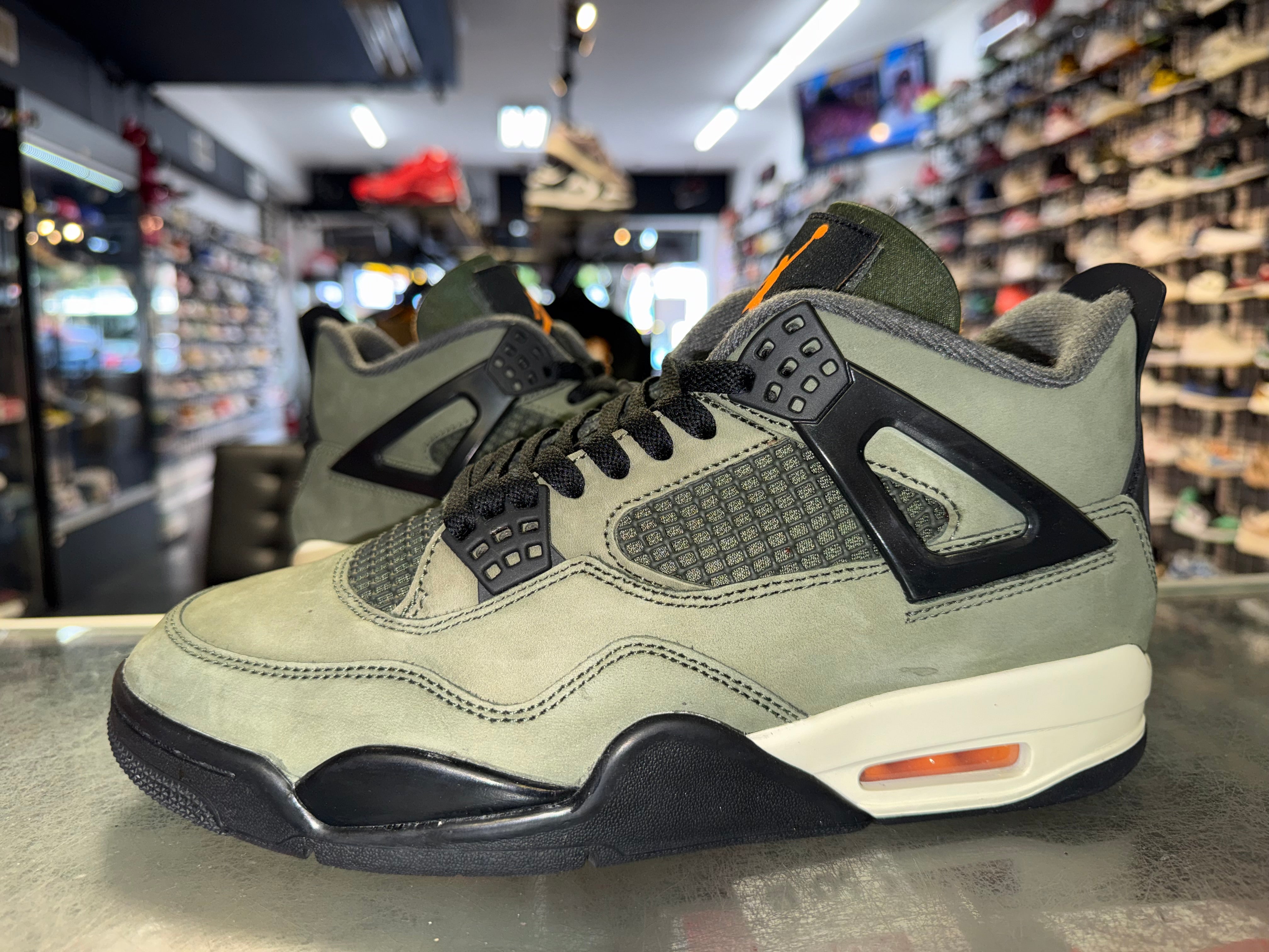 Size 8.5 Air Jordan 4 “Undefeated”