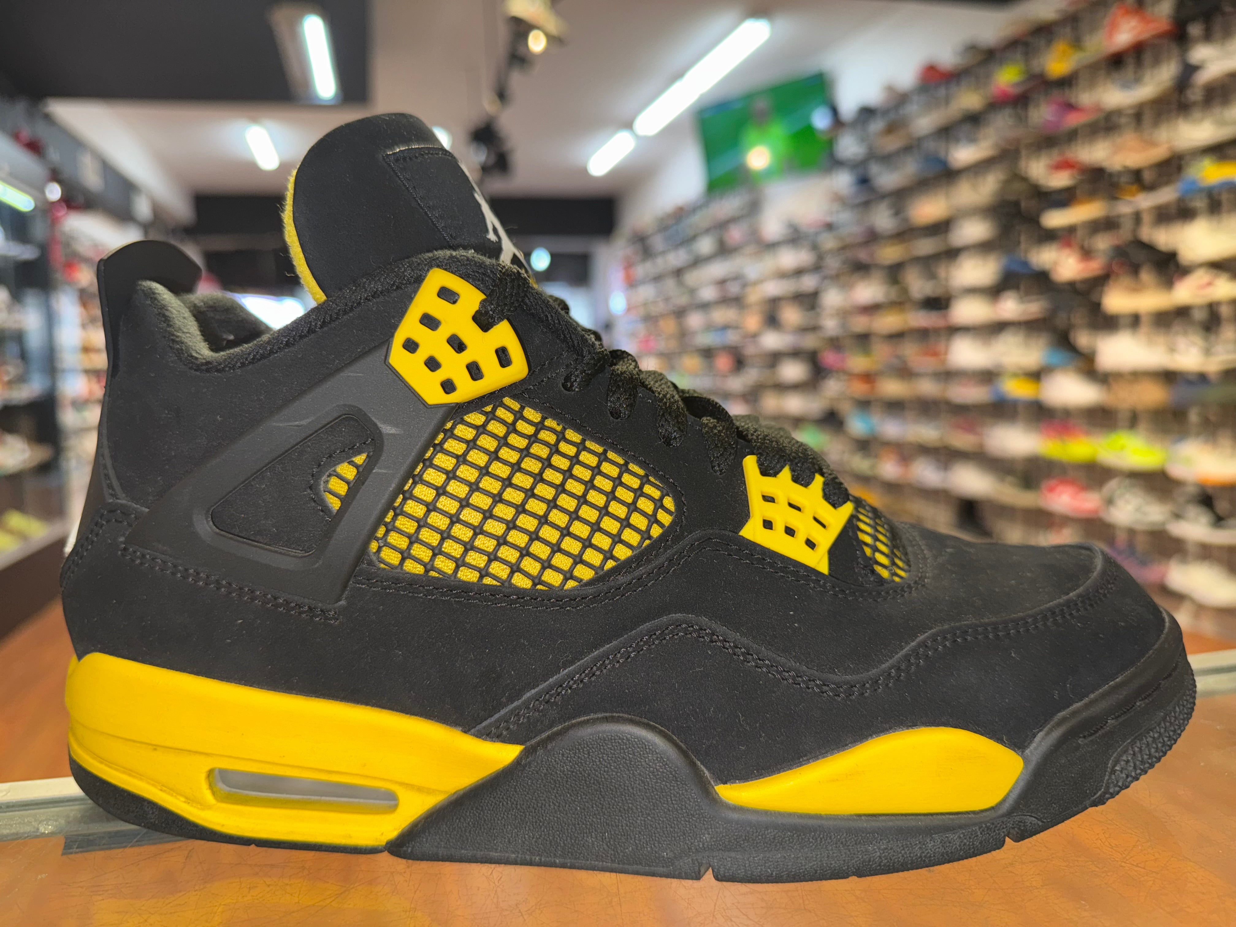 Size 9.5 Air Jordan 4 "Thunder"