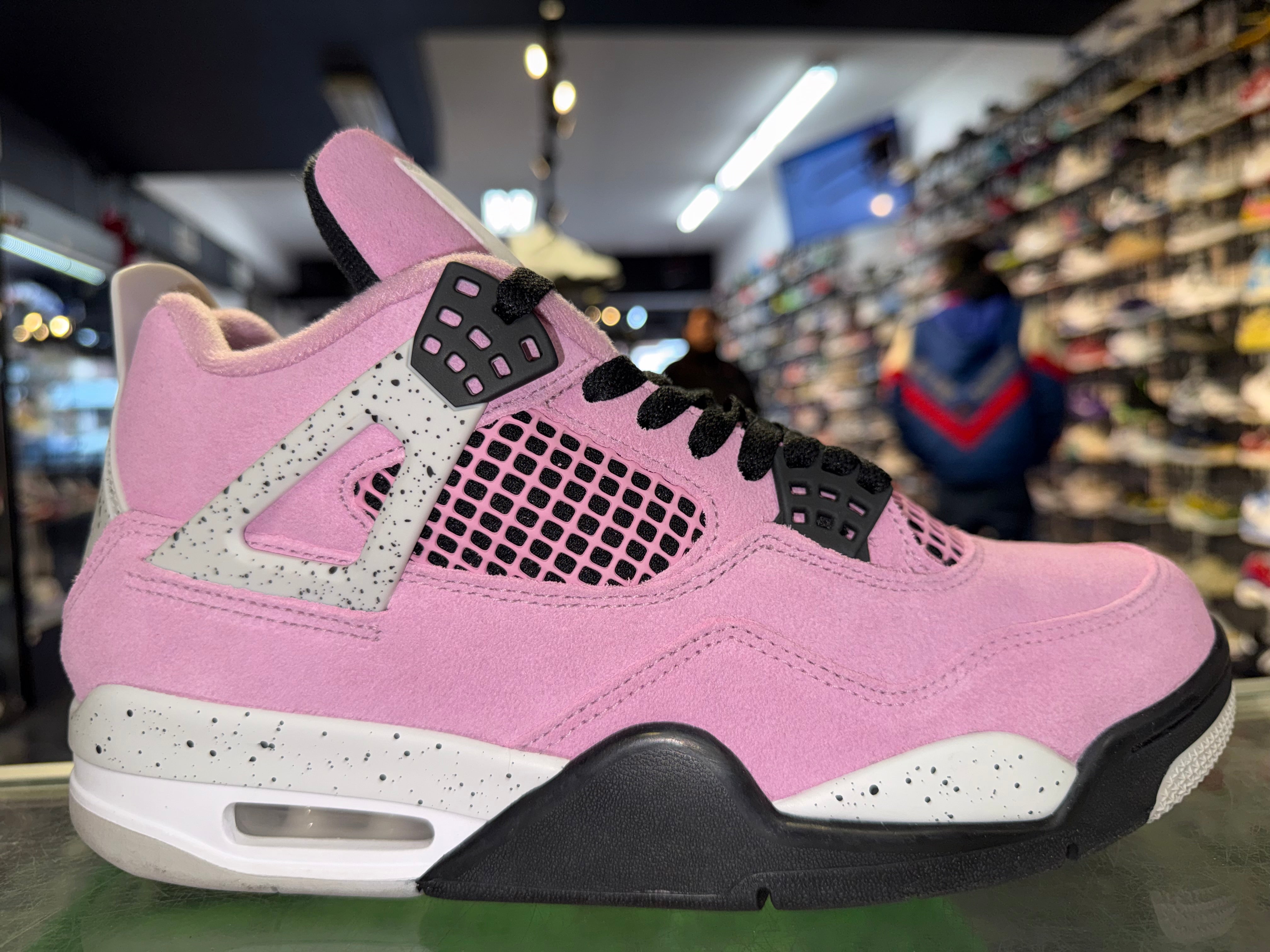 Size 9.5 (11W) Air Jordan 4 “Orchid”