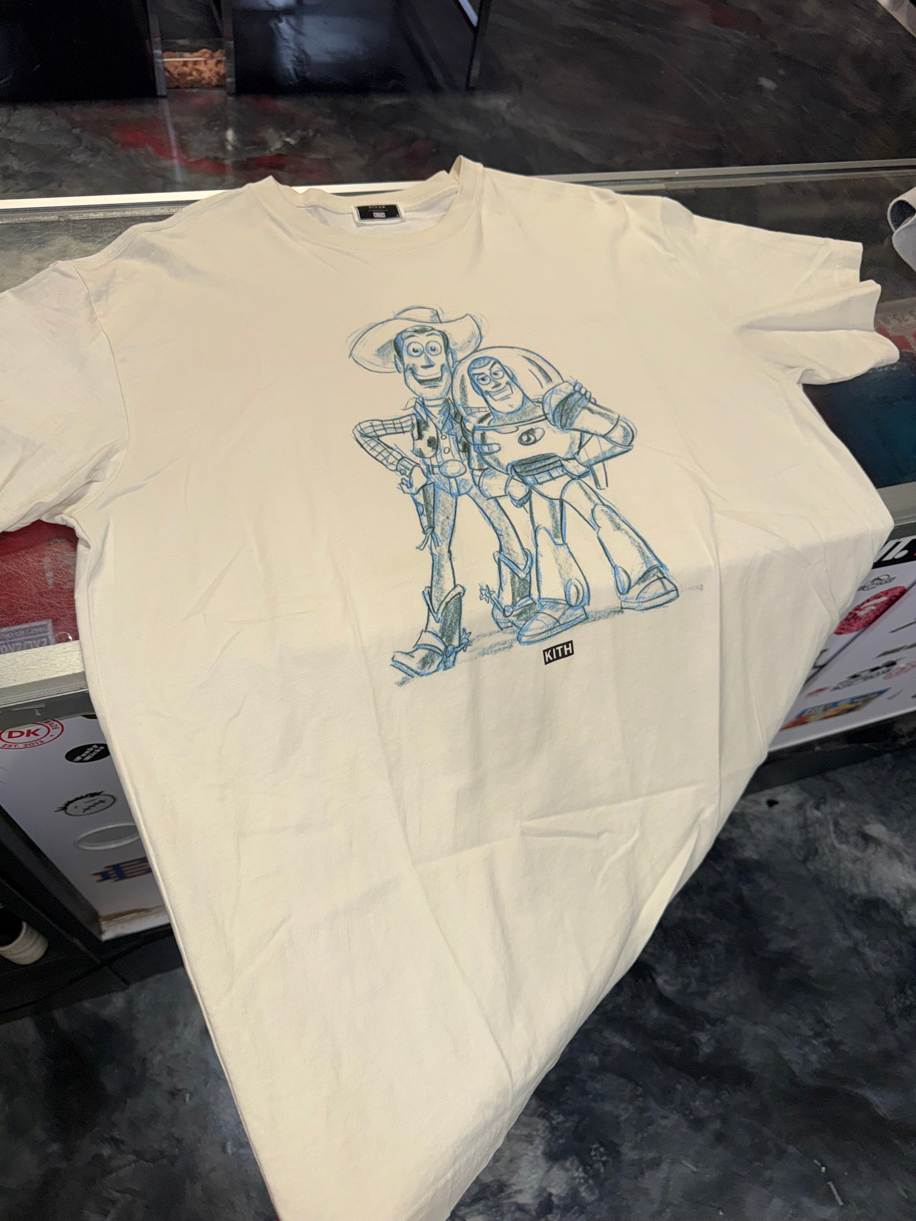 Size L Kith Toy Story Sketch Tee “Sandrift”
