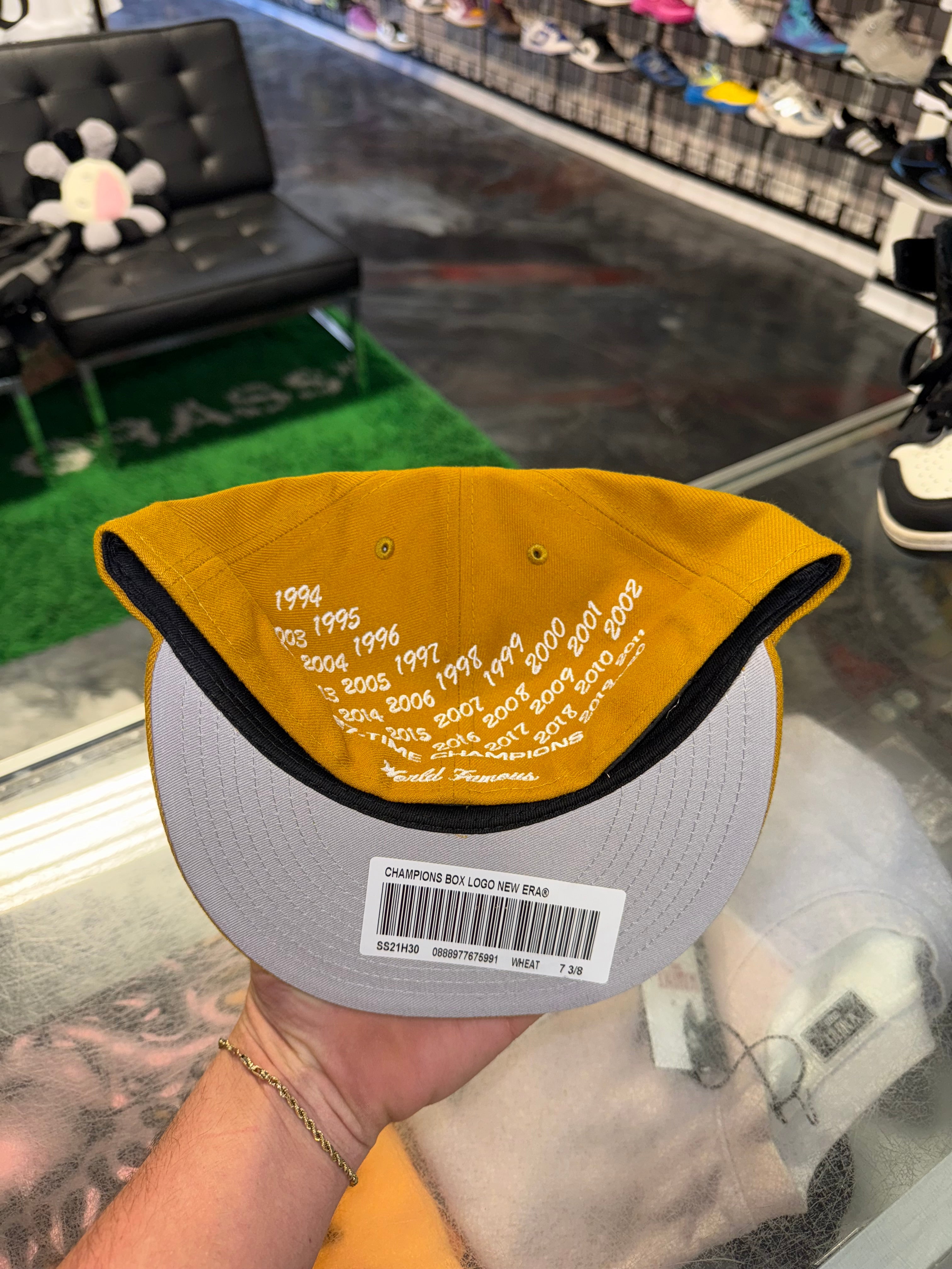 Size 7 3/8 Supreme Champions Bogo Fitted “Wheat” Brand New