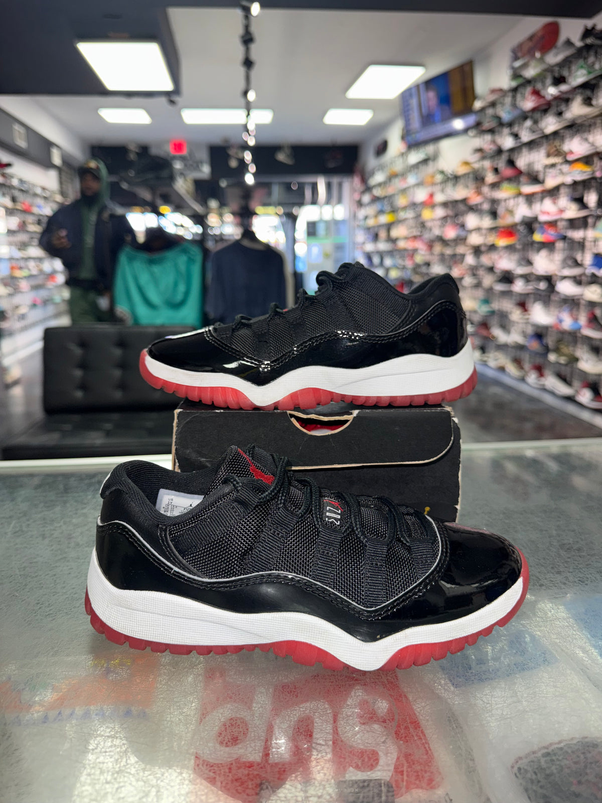 Air Jordan 11 Low Bred PS sneaker, pre-owned, size 1Y