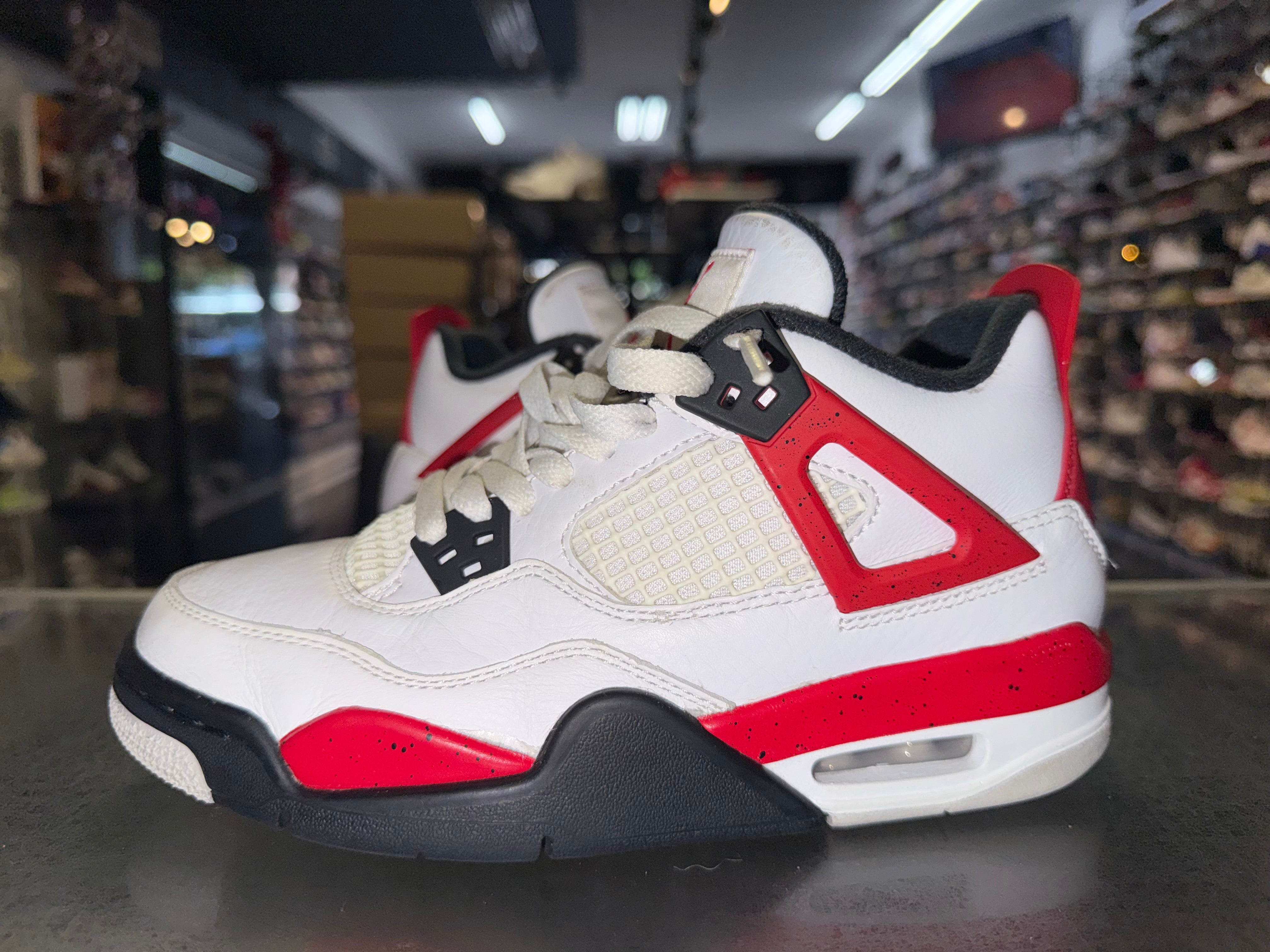 Size 4y Air Jordan 4 "Red Cement"