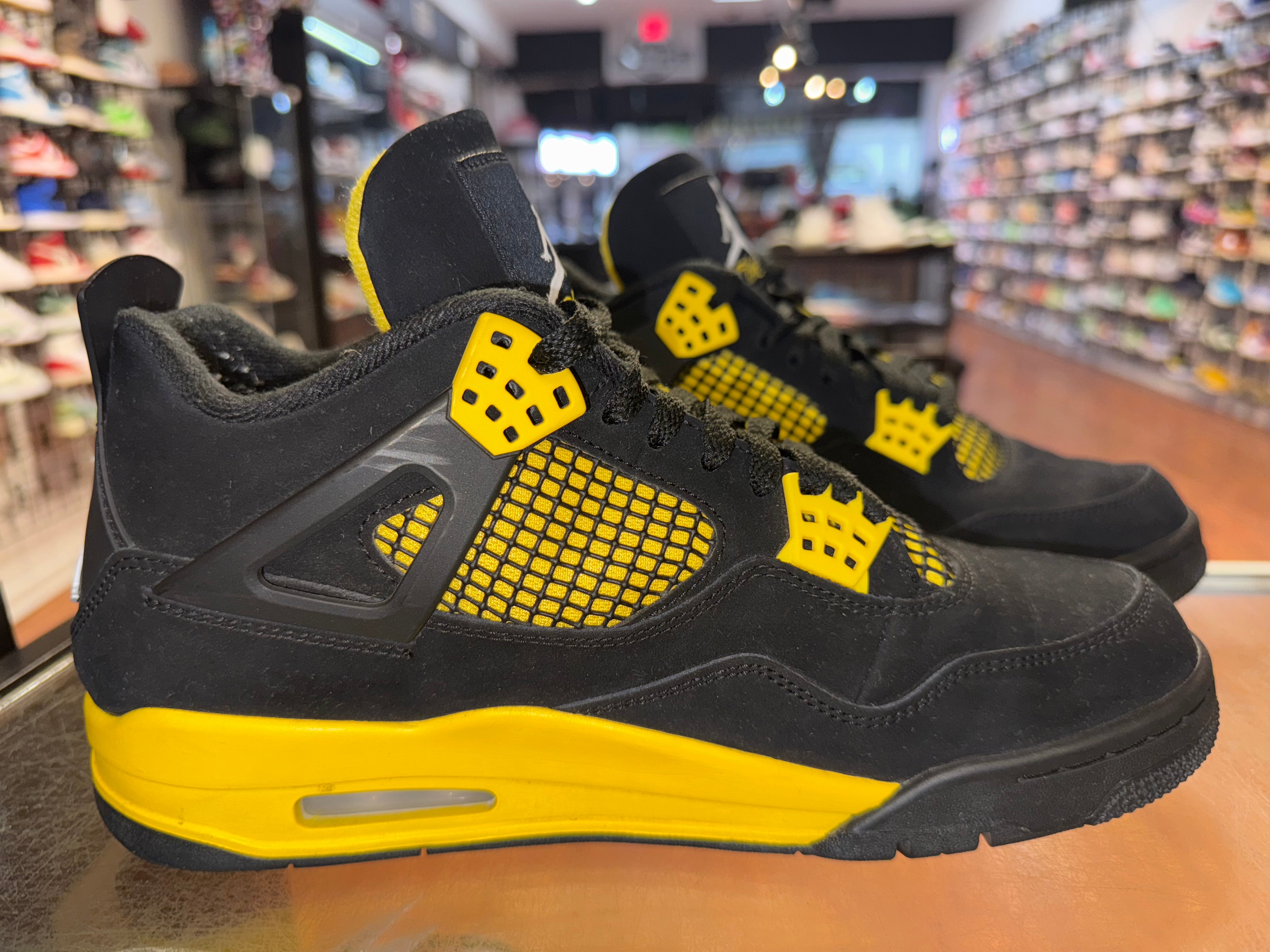 Size 9.5 Air Jordan 4 "Thunder"