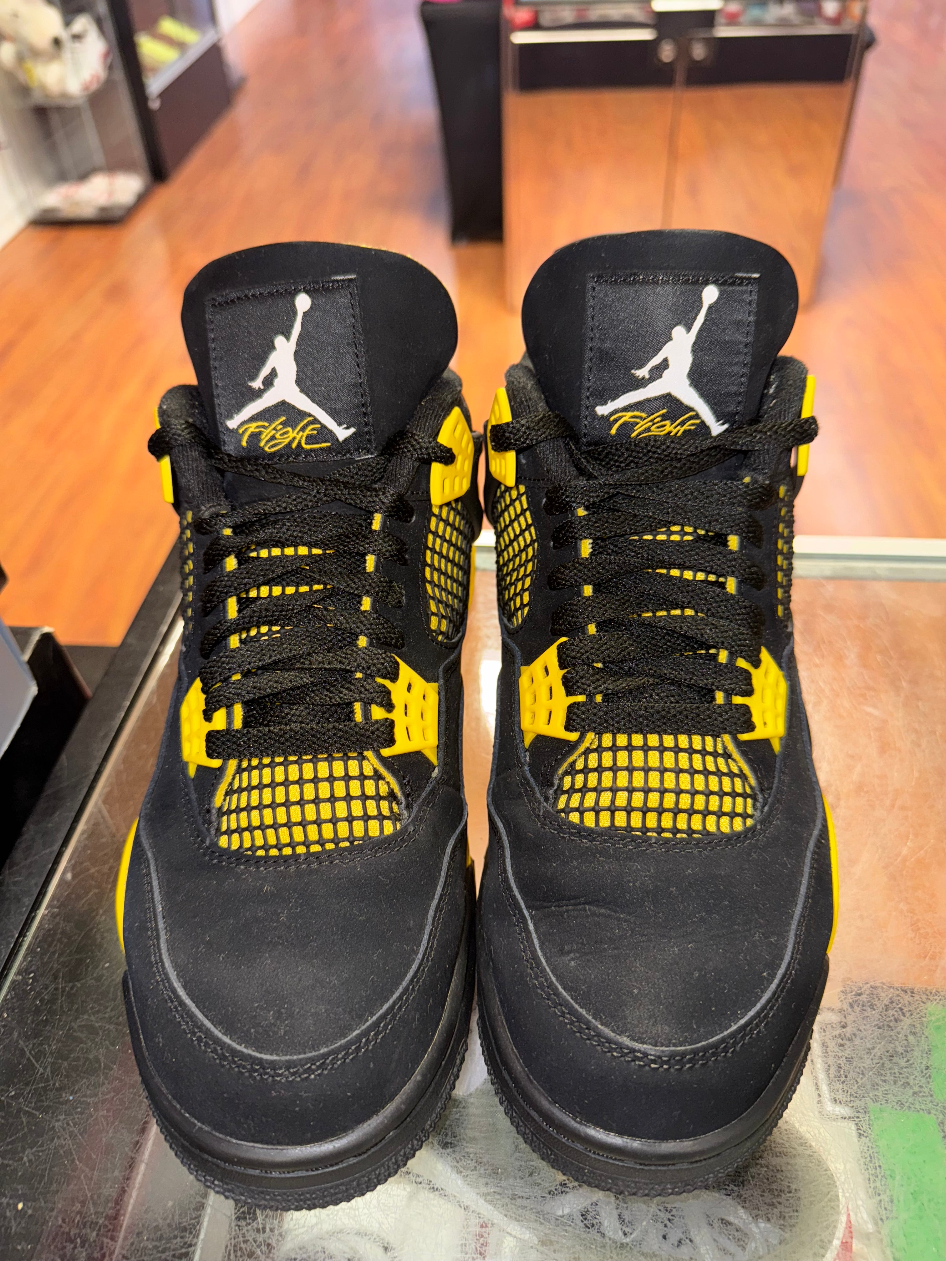 Size 9.5 Air Jordan 4 "Thunder"