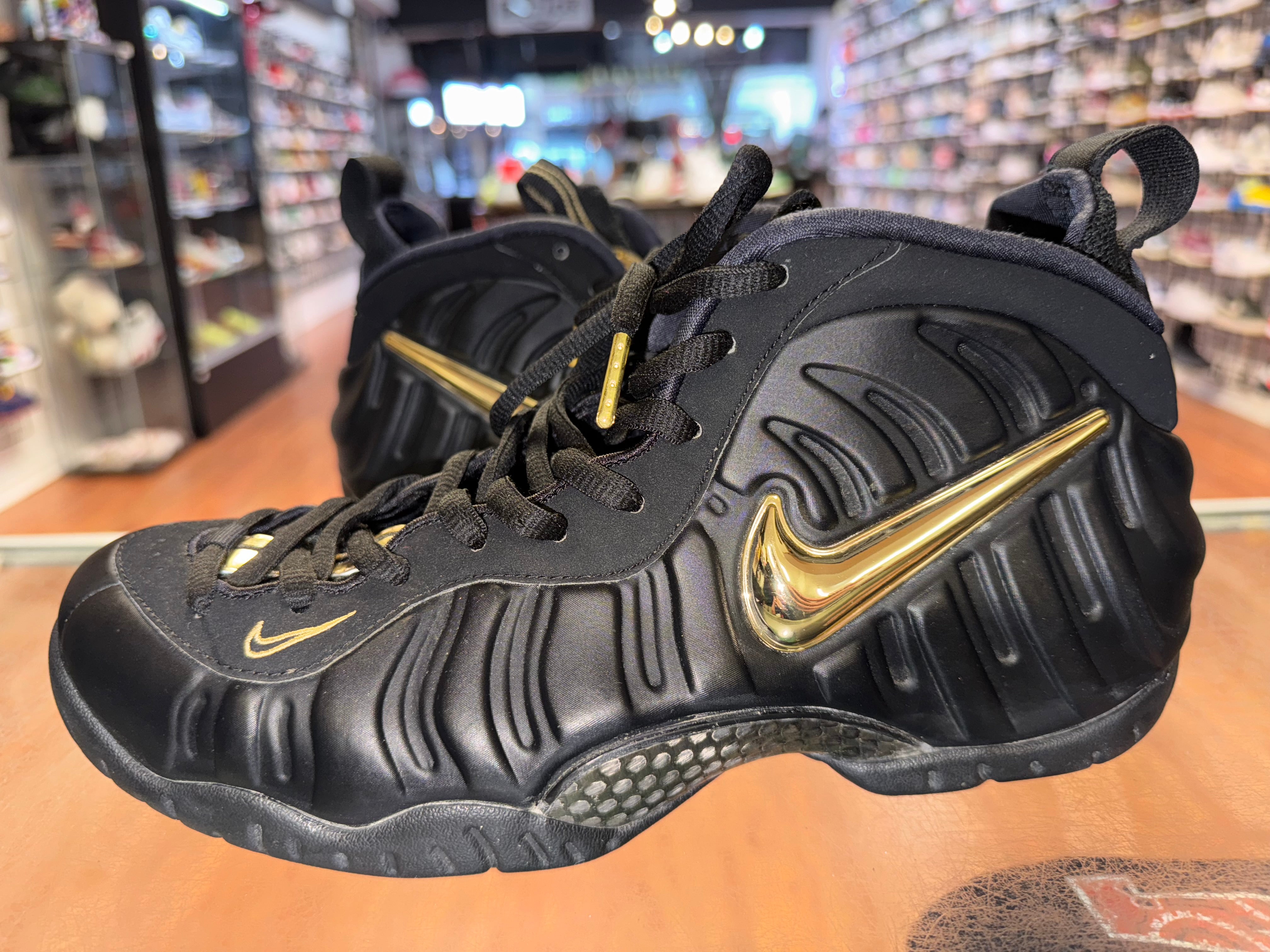 Size 9.5 Foamposite Pro "Black Metallic Gold"