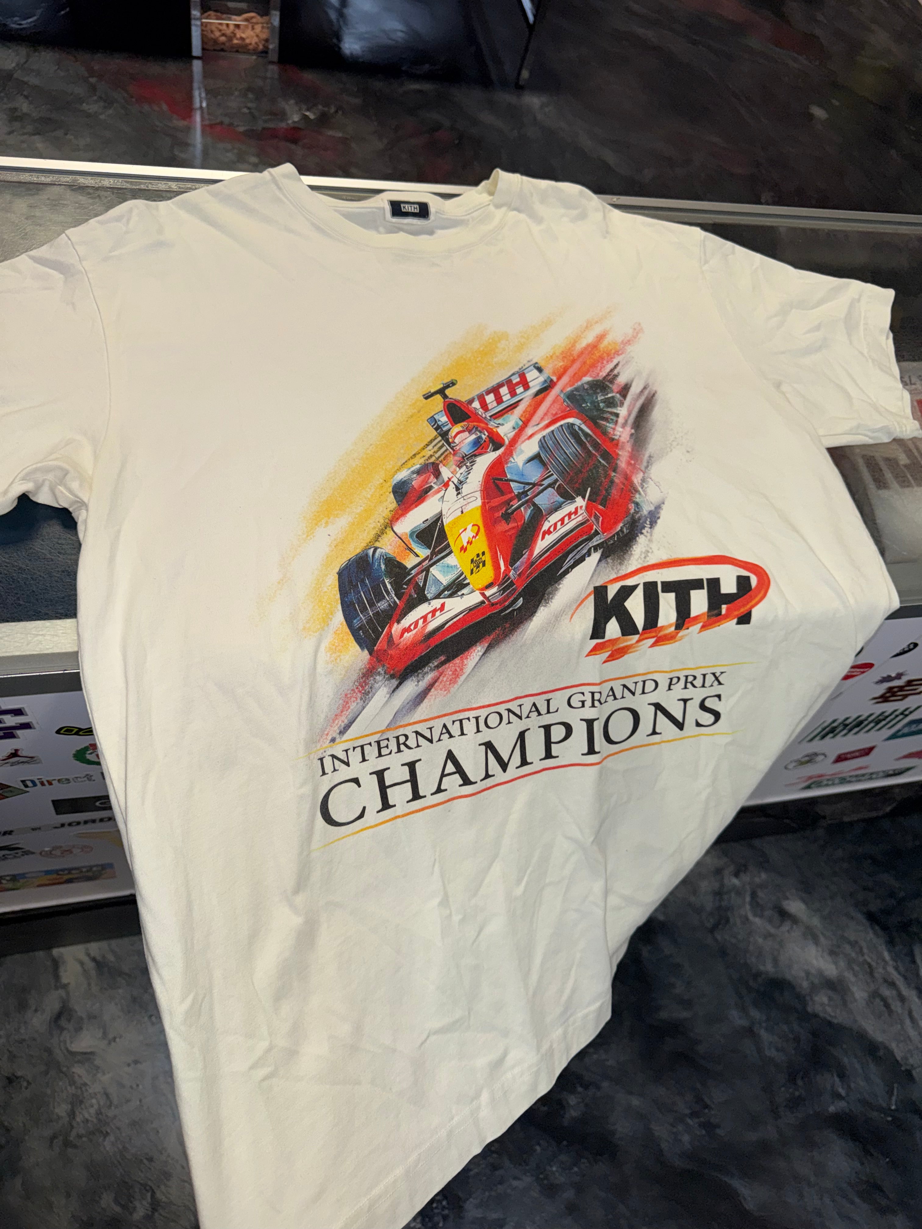 Size L Kith F1 Champions Tee “Cream”