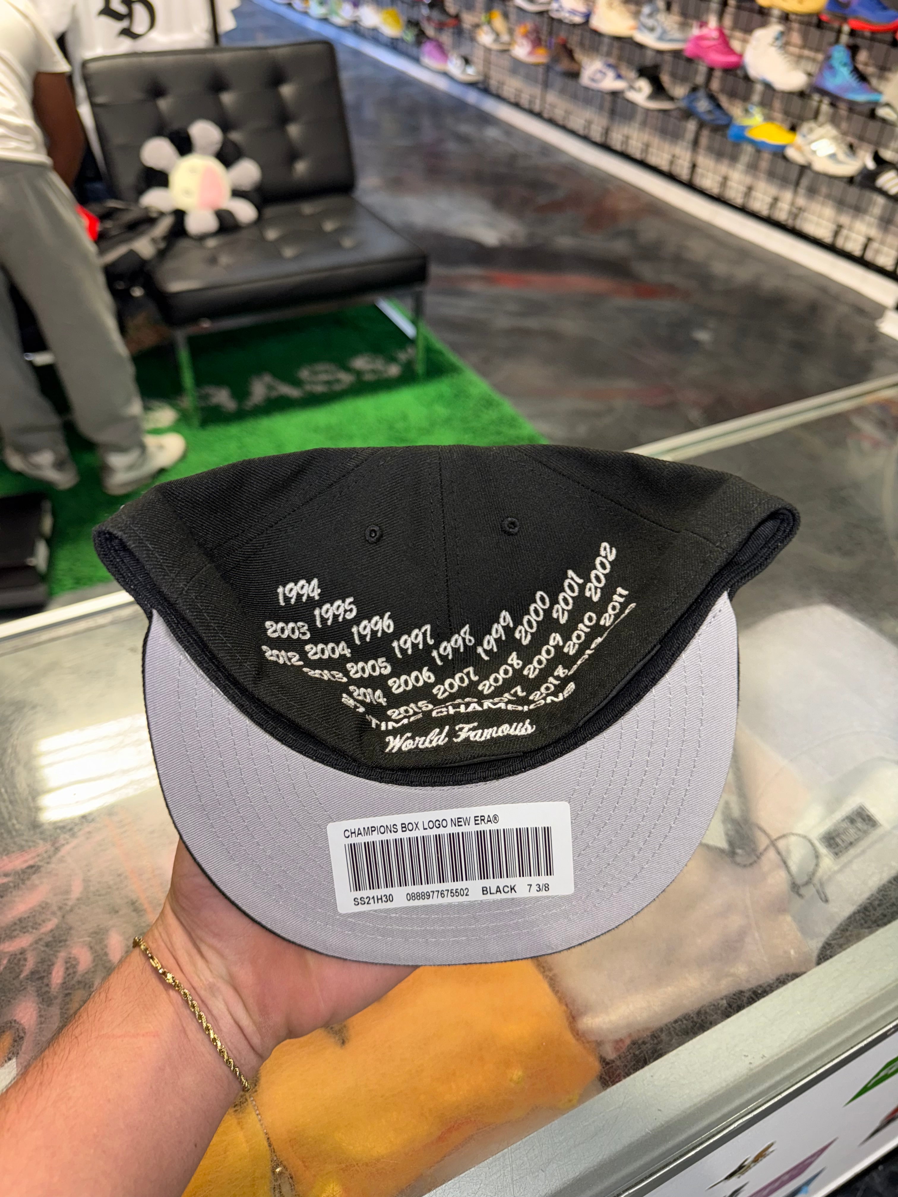 Size 7 3/8 Supreme Champions Bogo Fitted “Black” Brand New
