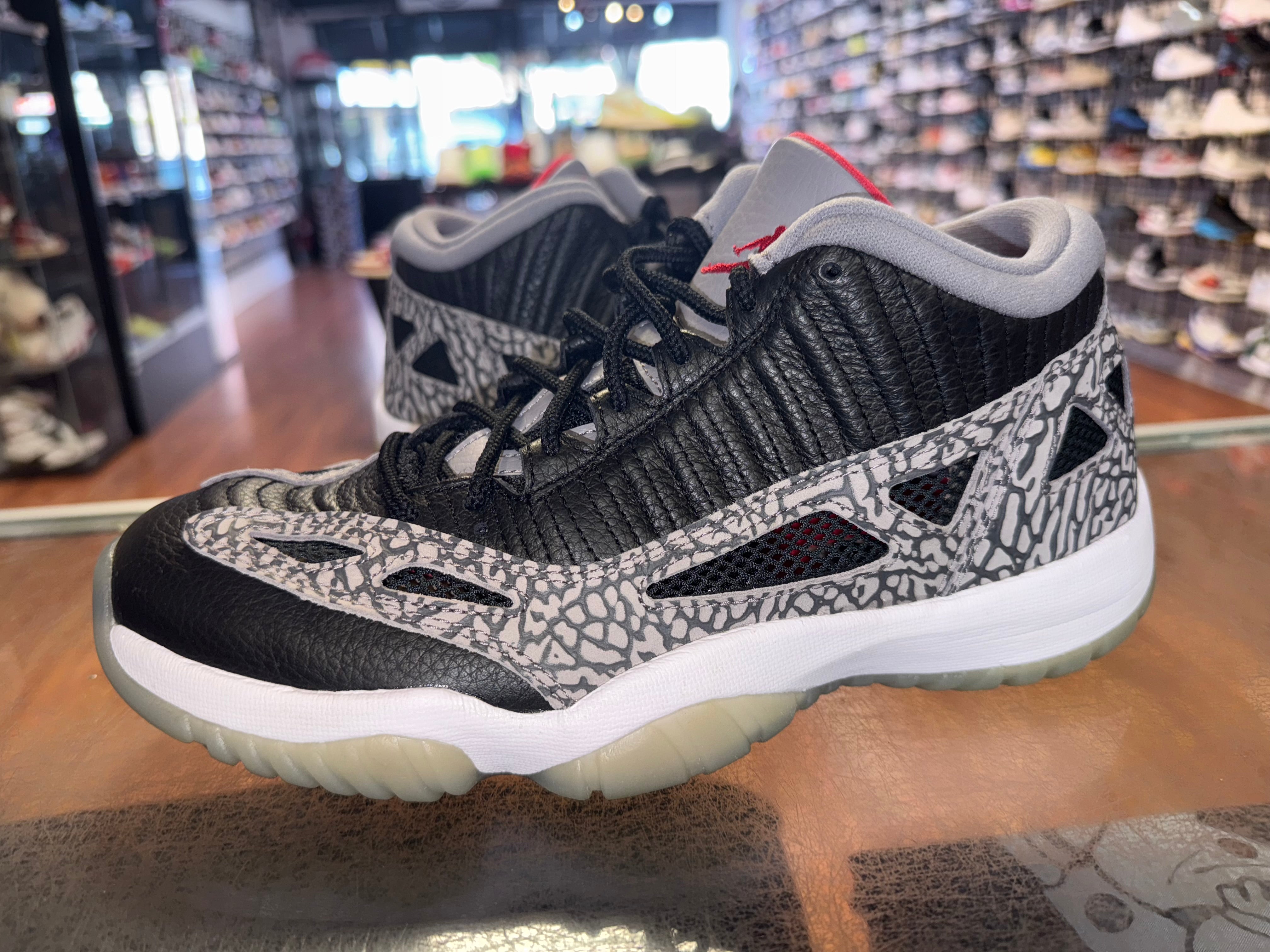 Size 8.5 Air Jordan 11 Low IE “Black Cement”